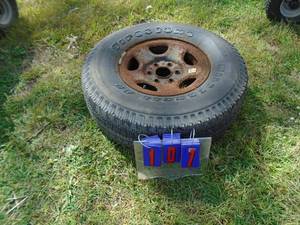 Spare tire Firestone P26575r16. Good tread. As shown.