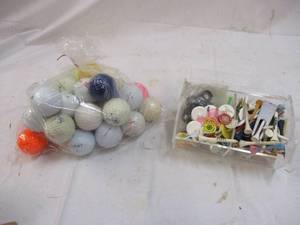 30 golf balls and container of golf...