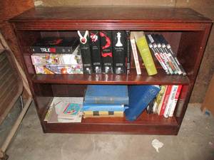 Small bookcase and its contents whi...