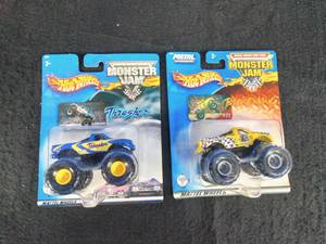 Two Vintage Mattel Hot Wheels Monster Jam Trucks 2003 Bid Dawg #22 and 2002 Thrasher