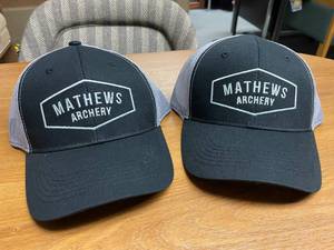 lot 86 image: (2) Mathews Archery Adjustable Caps