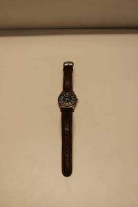 lot 13 image: Fossil Mood Watch with Unique Car-Shaped Tin Case
