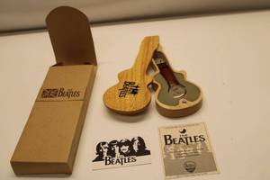lot 62 image: The Beatles Collectible Watch with Guitar-Shaped Wooden Case