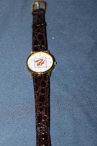 lot 101 image: Vintage Gold-Tone Watch with Brown Leather Strap