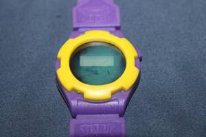 lot 104 image: Teddy Grahams Digital Watch - Purple and Yellow