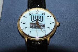 lot 212 image: Gold-Plated Watch with Hebrew Numerals and Menorah Design