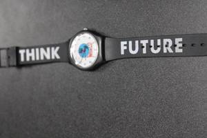 lot 56 image: Vintage Plastic Analog Wristwatch with Think Future Strap