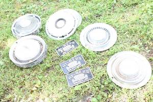 lot 51 image: Lot of Vintage Automotive Hubcaps and Hi-Revs Plaques