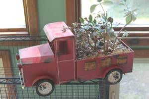 lot 70 image: Vintage Red Metal Truck Planter with Succulent Plants
