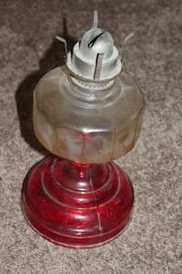 lot 88 image: Vintage Glass Oil Lamp with Red Base