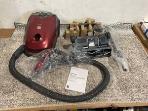 lot 143 image: Kenmore 600 Series Friendly Lightweight Bagged Canister Vacuum with Pet PowerMate, Red