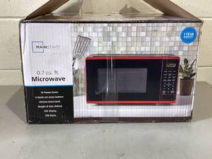 lot 457 image: Mainstays 0.7 Cu ft Countertop Microwave Oven, 700 Watts, Red