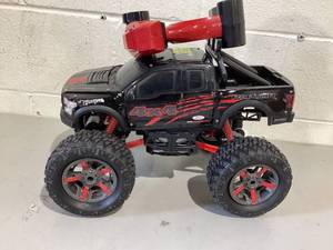 lot 382 image: New Bright (110) Ford F-150 Battery Remote Control Heavy Metal 4X4 Black Truck
