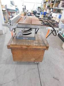 lot 73 image: Antique Craftsman Table Saw- 34 HP On cabinet with casters