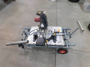 lot 90 image: Chicago 10 Sliding Compund Miter Saw With Fold up Stand on Wheels