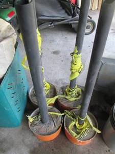 4 Pylon markers with cement bases...
