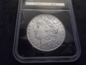 lot 18 image: 1884 CC Morgan Silver Dollar