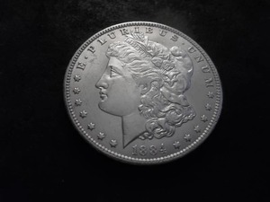 lot 19 image: 1884 O Morgan Silver Dollar