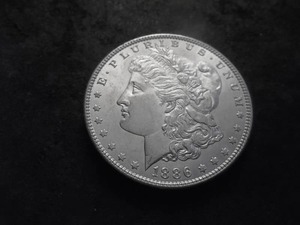 lot 23 image: 1886 Morgan Silver Dollar