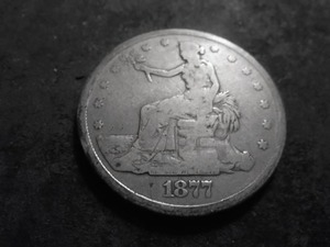 lot 67 image: 1877 S Trade Silver Dollar