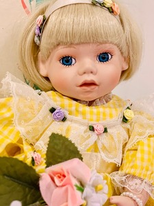 lot 160 image: Vintage Baby Book Treasures Doll with Flowers and Bunny
