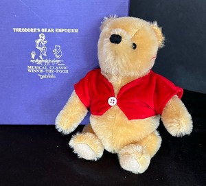lot 48 image: Theodores Bear Emporium Musical Classic Winnie the Pooh Bear Doll by Gabrielle