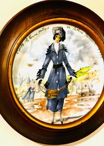 lot 65 image: Darceau-Limoges Vintage Framed Plate Edith la Femme Pratique en Costume Tailleur 1975