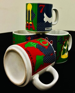 lot 183 image: Holidays are Around the Corner - 4 Holiday Mugs with 12 Days of Christmas
