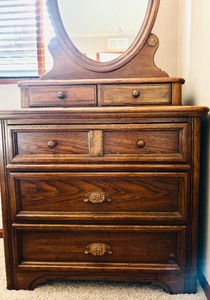 lot 18 image: Vintage Four Drawer Wooded Dresser with Oval Mirror by Dixie