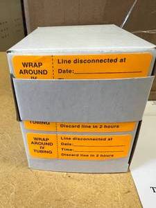 lot 31 image: MSRP $300  1 Case (12 each boxes) NEW Wrap Around IV Tubing Label Rolls - Orange