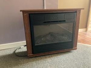 lot 122 image: Electric fireplace in a nice wood frame