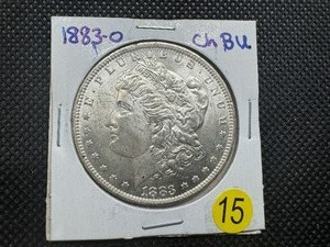 lot 15 image: 1883-O  Morgan Silver Dollar Marked Choice BU When Purchased