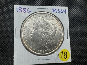 lot 18 image: 1886 Morgan Silver Dollar Marked MS64 When Purchased