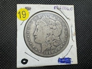 lot 19 image: 1886-O Morgan Silver Dollar