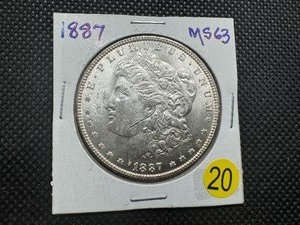 lot 20 image: 1887 Morgan Silver Dollar Marked MS63 When Purchased
