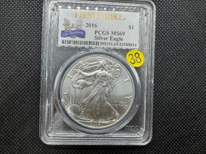 lot 38 image: 2016 American Silver Eagle 30th Anniv. FIRST STRIKE PCGS MS69 - PCGS Price Guide is $58