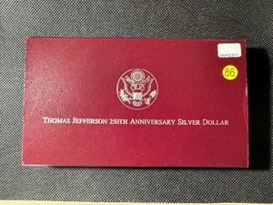 lot 86 image: 1993-S Thomas Jefferson 250th Anniv. Silver Dollar in Mint package with Certificate of Authenticity
