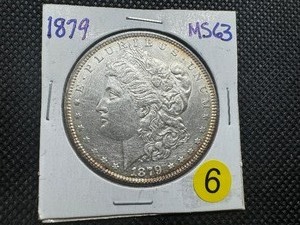 lot 6 image: 1879 Morgan Silver Dollar Marked MS63 When Purchased