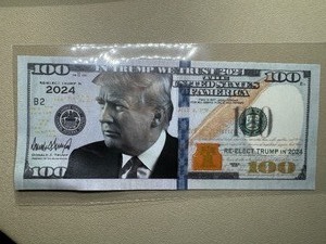 lot 95 image: Trump 2024 One Hundred Dollar Bill and Trump Gold Plated Coin