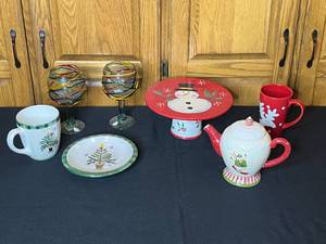 lot 11 image: Lot of Assorted Holiday Themed Ceramic Mugs, Plate, Cake Stand, Teapot, and Glassware