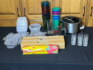 lot 33 image: Kitchen Accessories Lot with Food Storage Containers, Glassware, Wrap Dispenser, and Slow Cooker