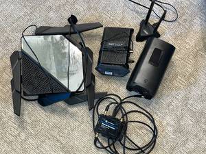 lot 48 image: Lot of Networking Devices - Modem, Router, and Signal Booster