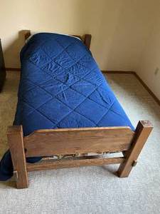 lot 64 image: Wooden Twin Bed Frame with Mattress and Bedding