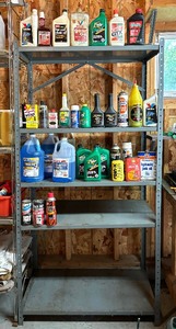 lot 338 image: Metal Storage Shelf with Variety of Garage Chemicals