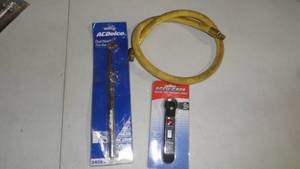 lot 81 image: (3 Items) Goodyear 3 x 38 Rubber Whip Hose Yellow 250 Psi with Swivel Fitting & Dual Head Tire Gauge & Digital Tire Gauge