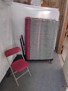 lot 49 image: (50) Resilient Brand Stackable Folding Chairs, Maroon Poly seatback with sturdy gray metal frame. 