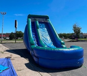 lot 23A image: Blue giant slide inflatable. 16H x 25L x 10.5 W with 20 deep pool at the end of the slide