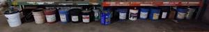 lot 82 image: 5-gallon buckets of oil, hydraulic fluid, washer solvent, gear lube, methanol, brake cleaner, transmission fluid.