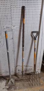 lot 149 image: Land tamper, landscaping rake, and pitch fork.