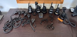 lot 199 image: (6) Walkie talkies & desktop chargers (5) Motorola PMMN4013A Speakermic (1) Motorola HMN9030A External Speaker and Mic
